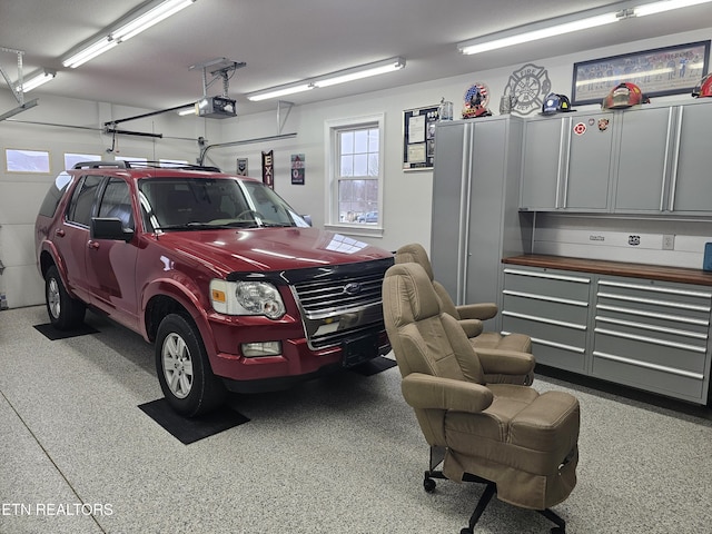 garage featuring a garage door opener