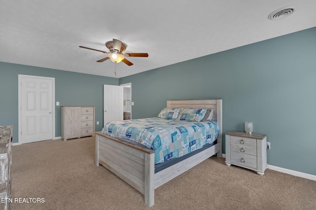 carpeted bedroom with ceiling fan, visible vents, and baseboards