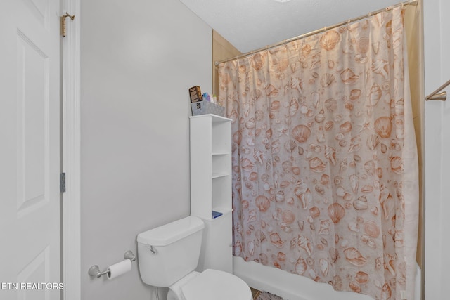 bathroom with toilet, shower / bath combination with curtain, and a textured ceiling