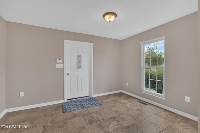 entrance foyer with baseboards and visible vents