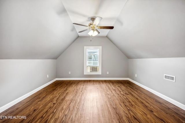 bonus room with visible vents, a ceiling fan, vaulted ceiling, wood finished floors, and baseboards