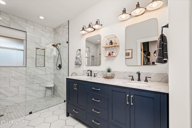 bathroom with double vanity, walk in shower, a sink, and recessed lighting