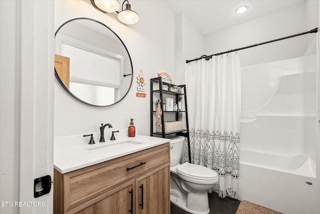 bathroom featuring shower / tub combo, vanity, toilet, and tile patterned floors