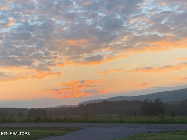 property view of mountains featuring a rural view