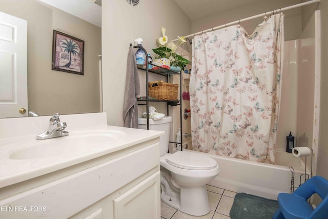 full bath with vanity, shower / bath combo with shower curtain, toilet, and tile patterned floors