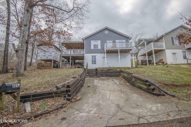 view of front facade with a front yard and stairs