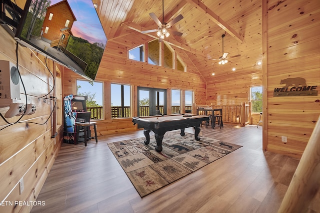 game room featuring wooden ceiling, wood finished floors, pool table, wood walls, and beam ceiling