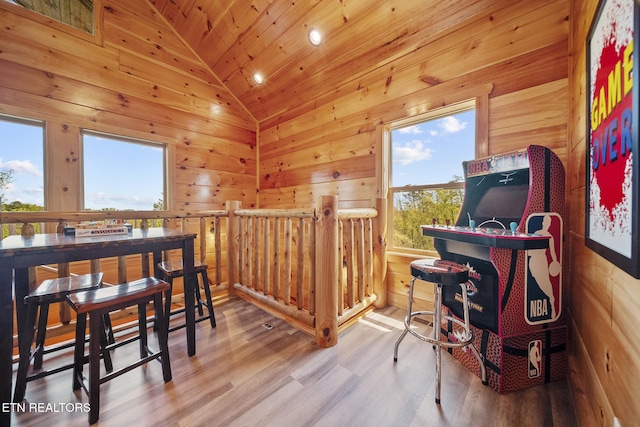 interior space featuring lofted ceiling, wooden ceiling, recessed lighting, wooden walls, and wood finished floors