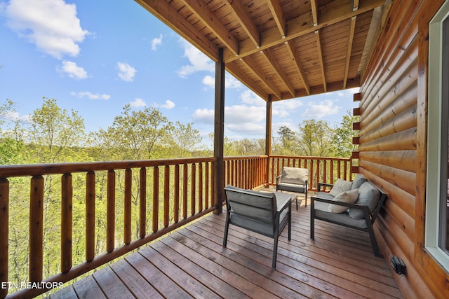 wooden deck with outdoor lounge area