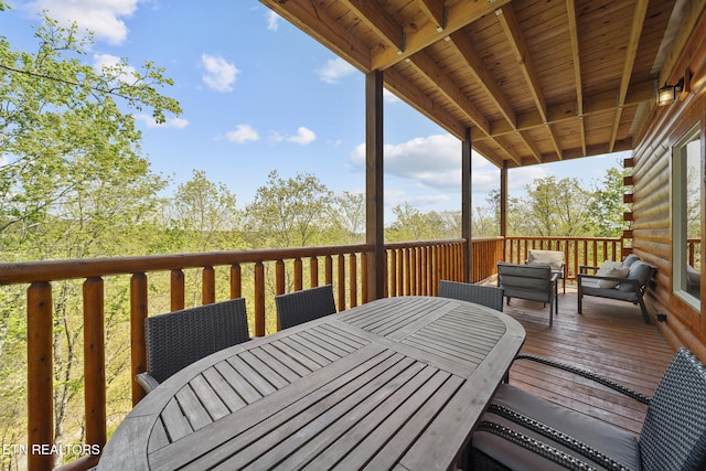 wooden deck with outdoor dining area