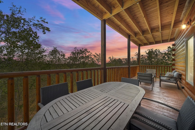 wooden terrace featuring outdoor dining space