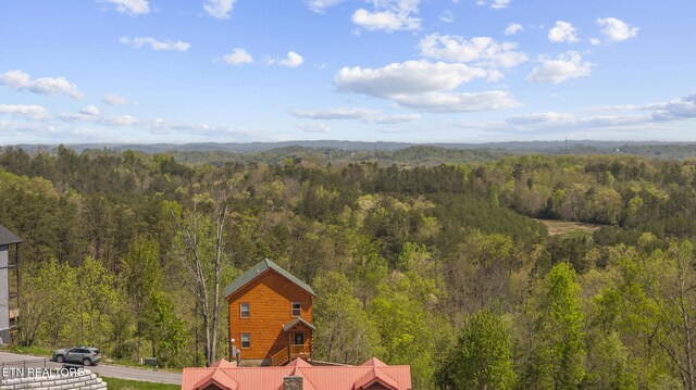 aerial view featuring a forest view