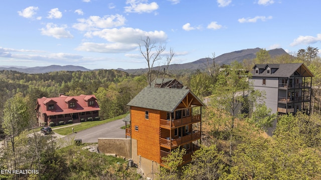 aerial view with a forest view and a mountain view