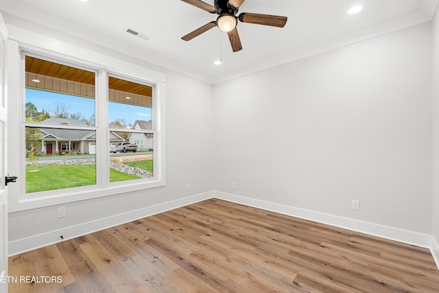 empty room with plenty of natural light, baseboards, and ornamental molding