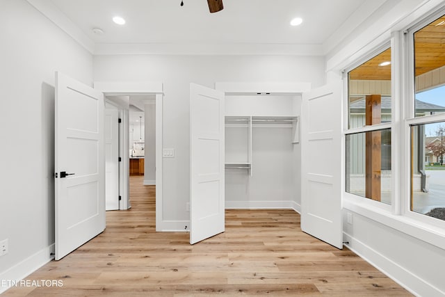 interior space featuring light wood-type flooring, baseboards, a closet, and recessed lighting