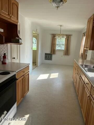 kitchen featuring a notable chandelier, brown cabinetry, and electric stove