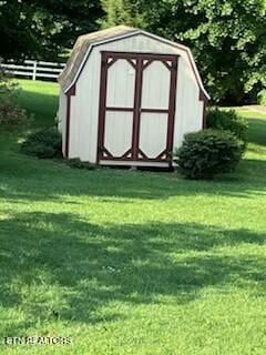 view of shed with fence