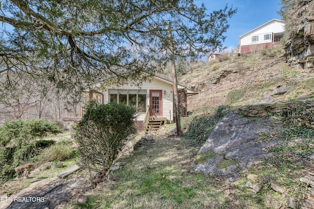 view of property exterior with entry steps