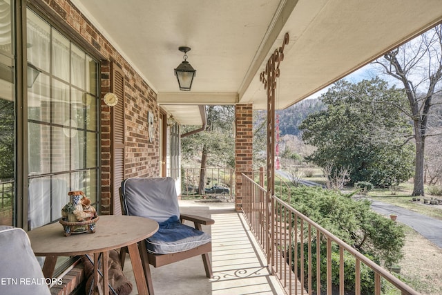 balcony featuring a porch