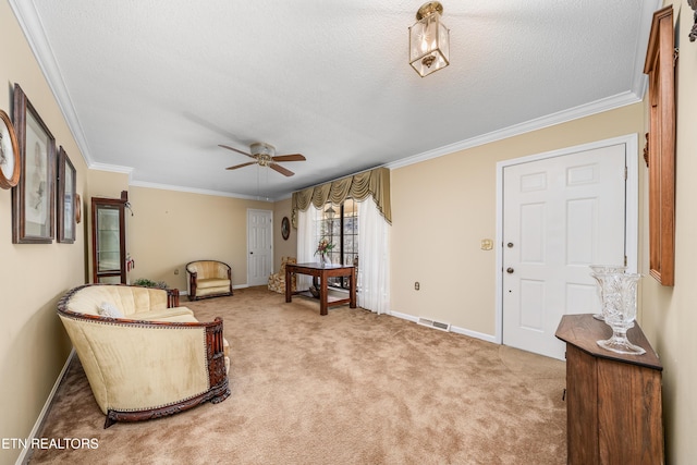 living area featuring a textured ceiling, crown molding, visible vents, and light carpet