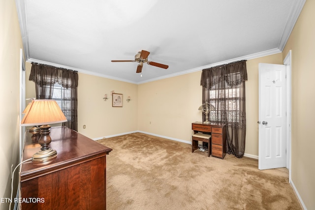 office space with ceiling fan, baseboards, light colored carpet, and ornamental molding