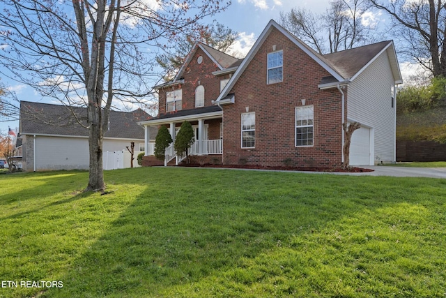 traditional home with brick siding, driveway, an attached garage, and a front yard