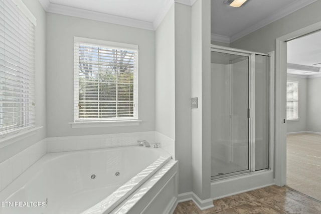 full bath with crown molding, a jetted tub, baseboards, and a stall shower