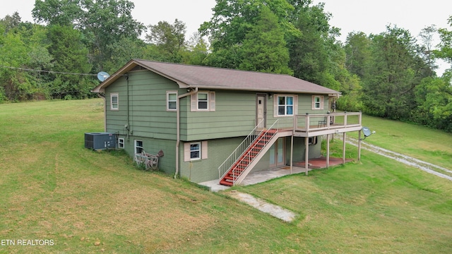 back of property featuring a patio, cooling unit, stairs, a yard, and a wooden deck