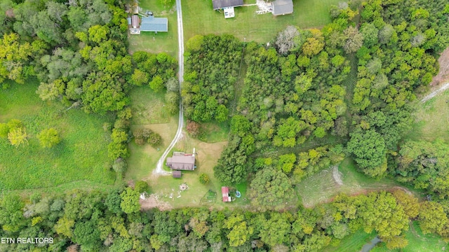 drone / aerial view featuring a view of trees