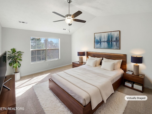 bedroom featuring visible vents, baseboards, a ceiling fan, carpet, and vaulted ceiling