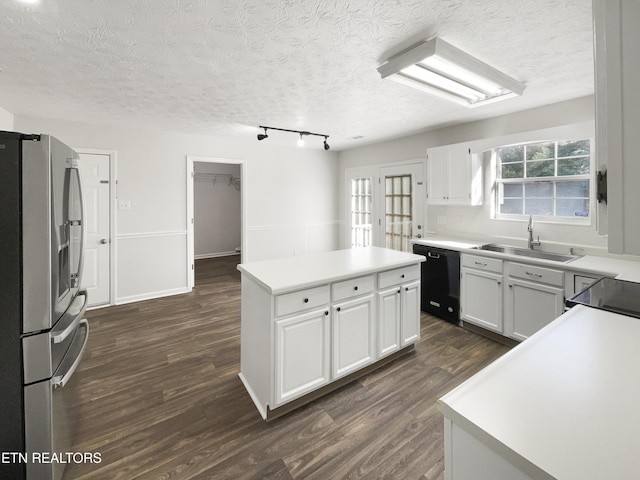 kitchen featuring black dishwasher, dark wood-style floors, a kitchen island, stainless steel refrigerator with ice dispenser, and a sink