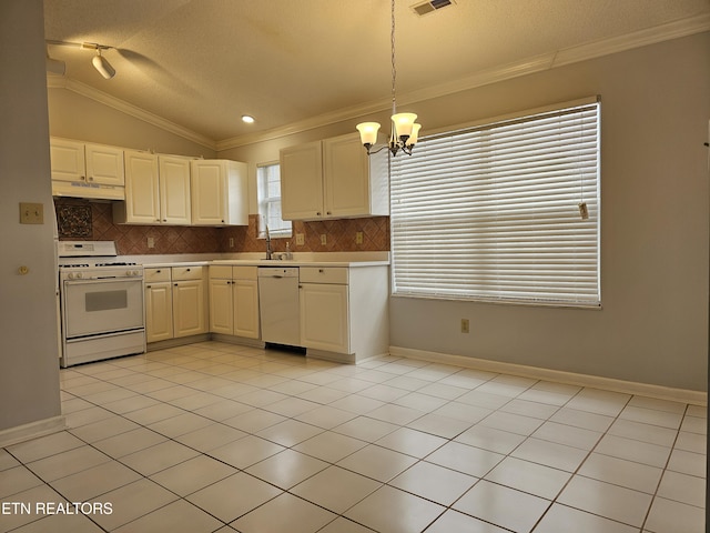 kitchen featuring white appliances, ornamental molding, vaulted ceiling, under cabinet range hood, and backsplash