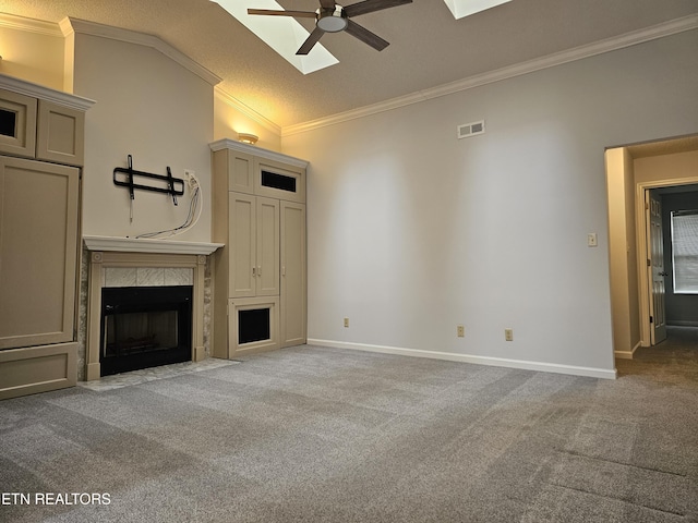 unfurnished living room featuring ceiling fan, a fireplace, visible vents, and light colored carpet