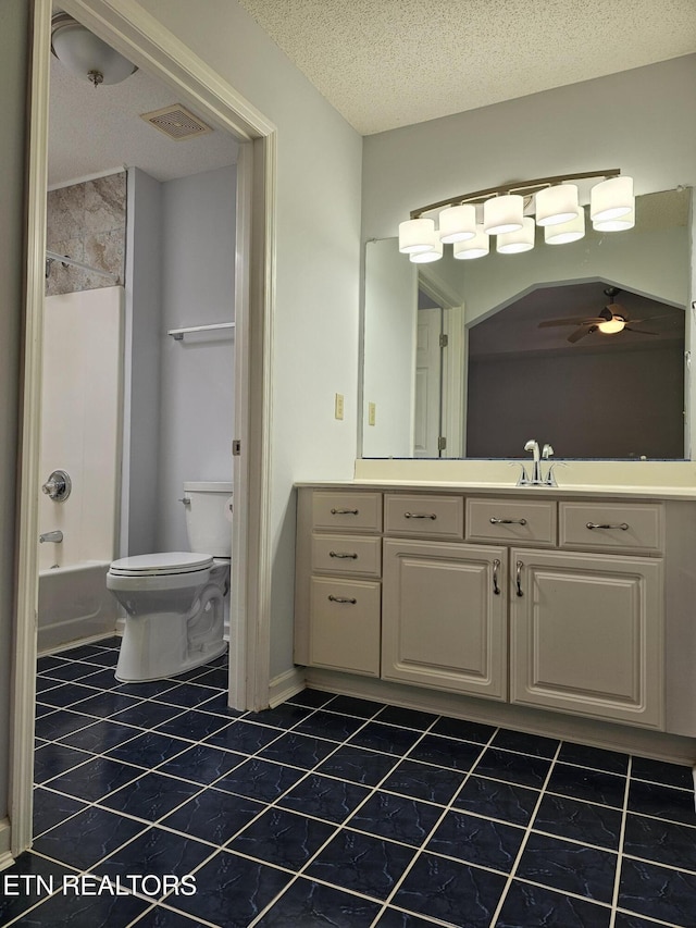 bathroom featuring shower / bath combination, visible vents, toilet, a textured ceiling, and vanity