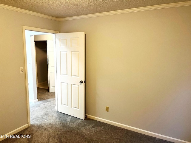 2442 Chastity Way, Knoxville, TN 37909 - spare room with dark colored carpet, crown molding, baseboards, and a textured ceiling