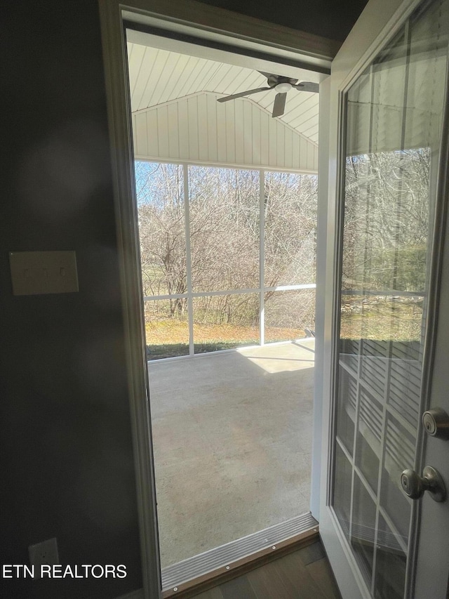 doorway to outside featuring a ceiling fan