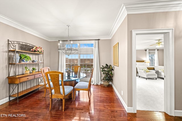 dining space featuring ornamental molding, plenty of natural light, and hardwood / wood-style floors