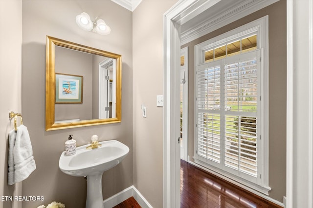 bathroom featuring baseboards and wood finished floors