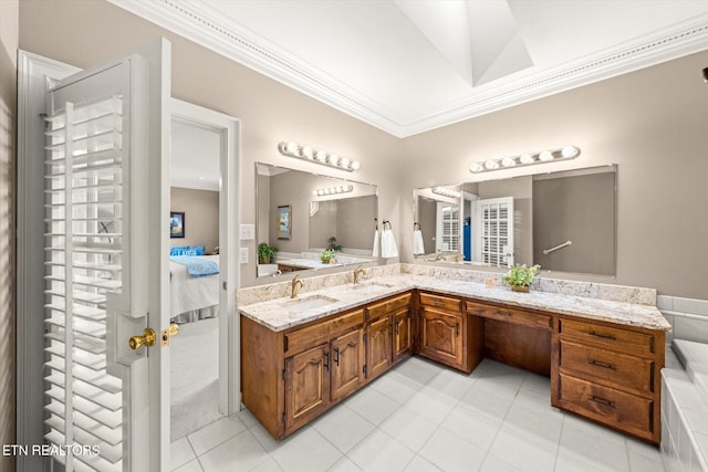 ensuite bathroom featuring crown molding, connected bathroom, and a sink