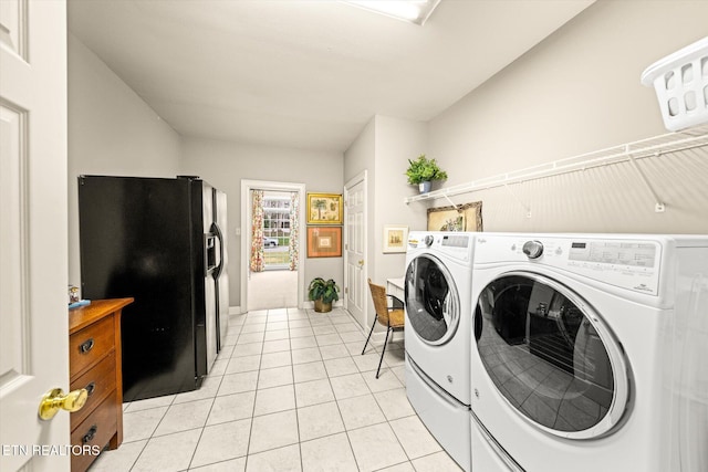 laundry area with light tile patterned floors, laundry area, and separate washer and dryer