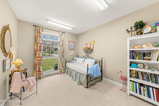 carpeted bedroom with baseboards