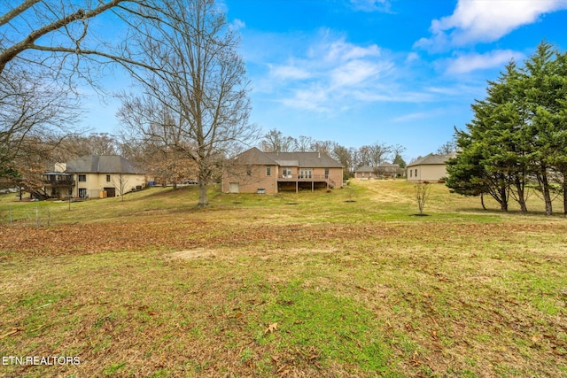 view of yard with a wooden deck