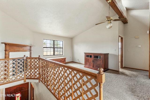 stairs with vaulted ceiling with beams, carpet flooring, ceiling fan, a textured ceiling, and baseboards