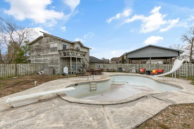 view of swimming pool featuring a fenced backyard and a patio