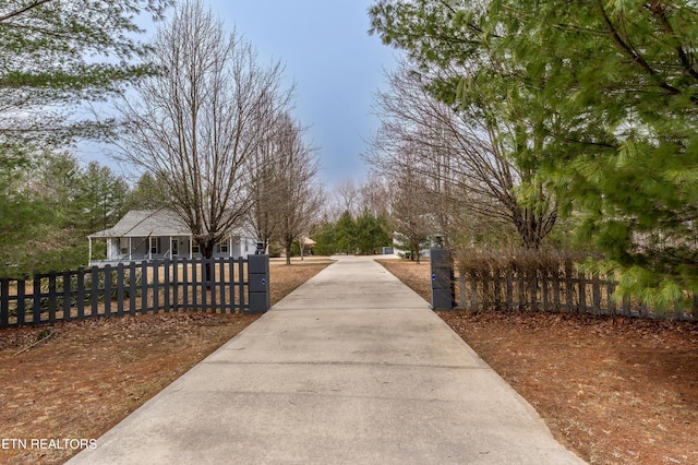 view of community with a fenced front yard