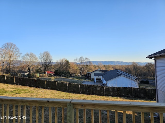 view of yard featuring a fenced backyard and a mountain view