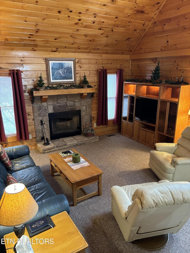 living room with wood walls, carpet, vaulted ceiling, and a wealth of natural light