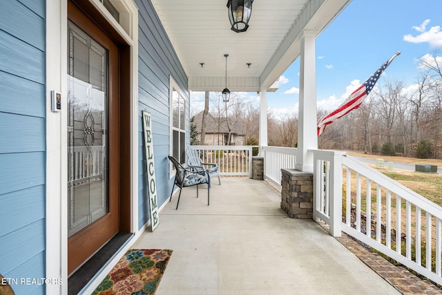 view of patio featuring a porch