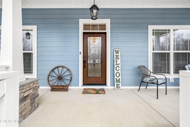 entrance to property featuring covered porch