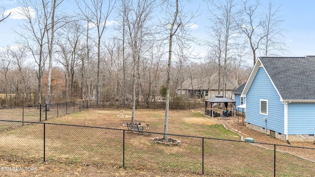 view of yard with a gazebo and a fenced backyard